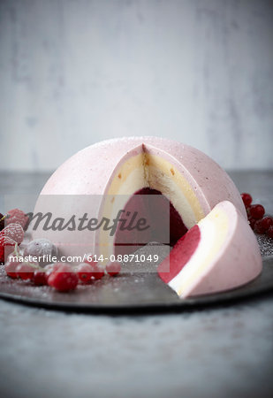 Plate of ice cream bombe with fruit