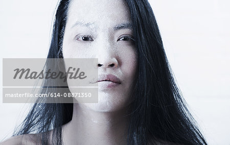 Woman's face covered in powder