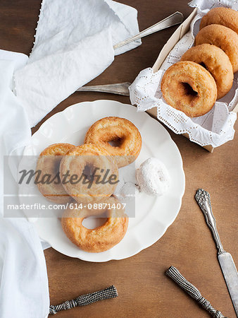 Plate of donuts on table Plate of donuts on table