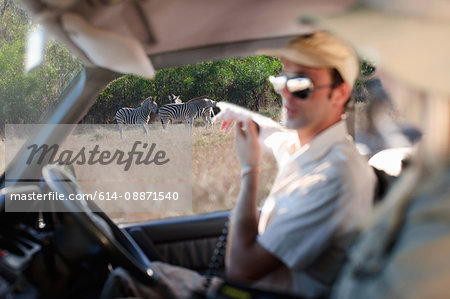 Guide pointing out zebras, Stellenbosch, South Africa Guide pointing out zebras, Stellenbosch, South Africa