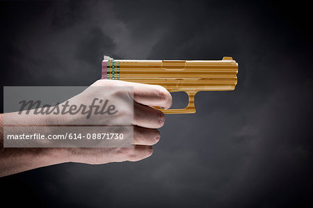 Person holding handgun made with pencils