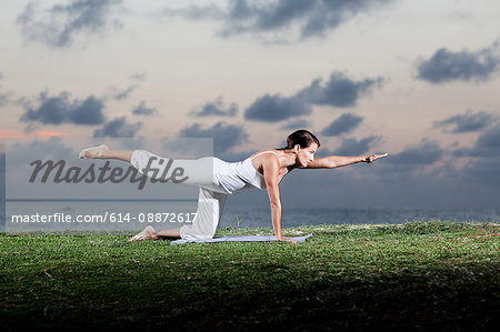 Woman in yoga pose outdoors