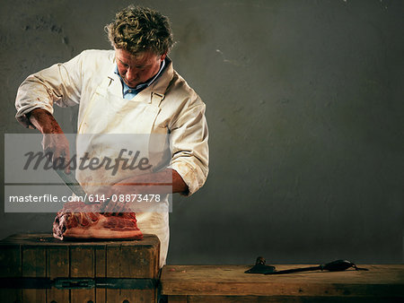 Butcher preparing meat