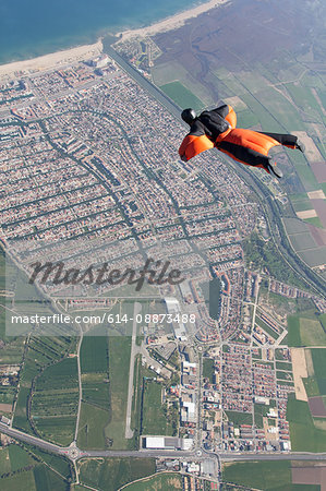 Man wingsuit flying over Empuriabrava, Spain