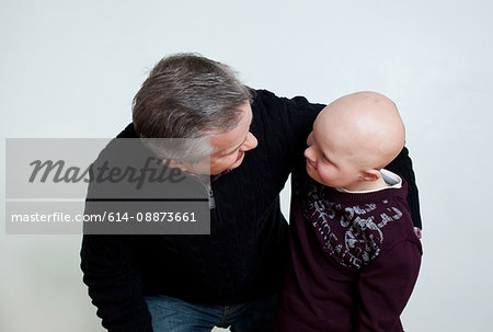 Father son with Down's Syndrome looking at each other