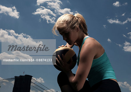 Woman resting with ball