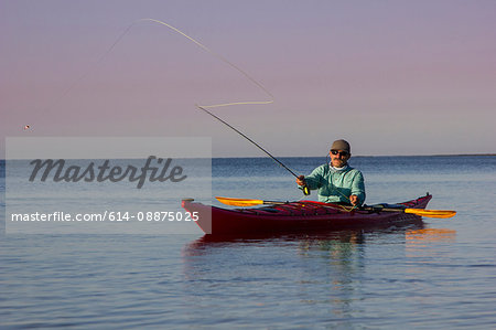 Man fly fishing from kayak in the Florida Everglades, USA
