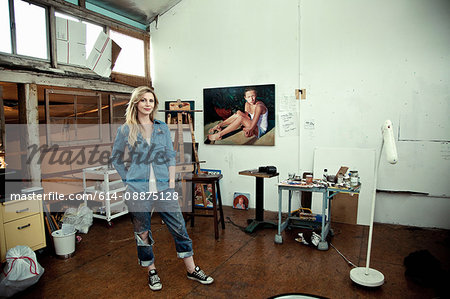 Mid adult woman standing in artist's studio, portrait