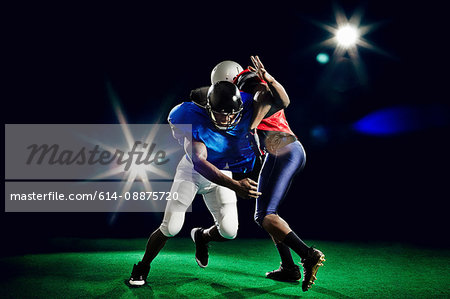 Two american footballers playing