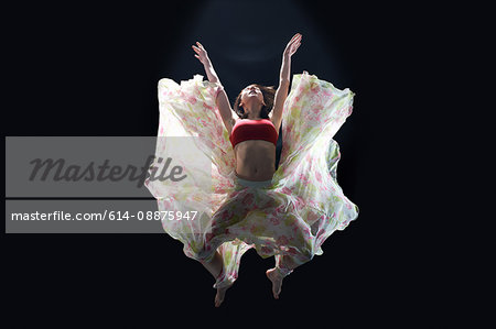 Dancer in midair wearing tutu