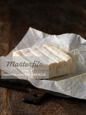 Still life with whole pont l'eveque cheese