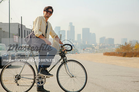 Young man on cycle, Los Angeles, California, USA