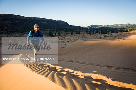 Male hiker on Star Dune, Coral Pink Sand Dunes State Park, Utah, USA