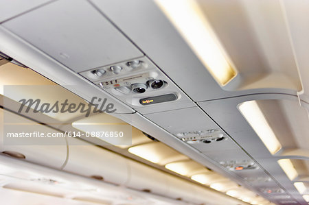 Ceiling of airplane above passenger seat