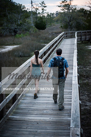 Hikers crossing bridge, Skidaway Island State Park , Savannah, Georgia, USA