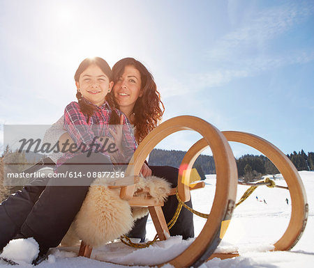 Mother and daughter on toboggan