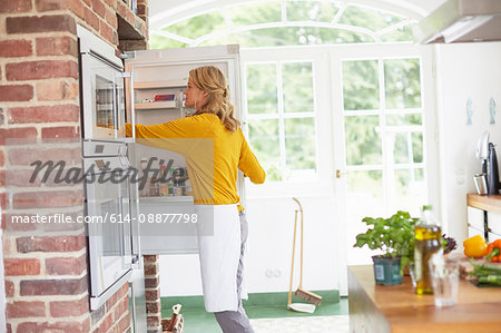 Woman preparing meal in kitchen