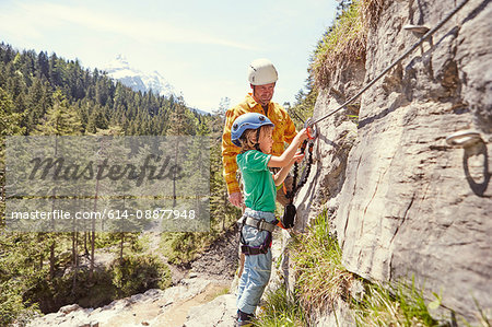 Father and child rock climbing, Ehrwald, Tyrol, Austria