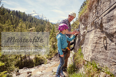 Father and child rock climbing, Ehrwald, Tyrol, Austria