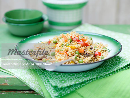 Vegetable rice in green vintage bowl