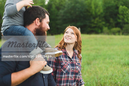 Mother and father, walking with son, outdoors