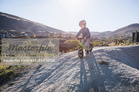 Boy going down hill on balance bike, Draper cycle park, Missoula, Montana, USA