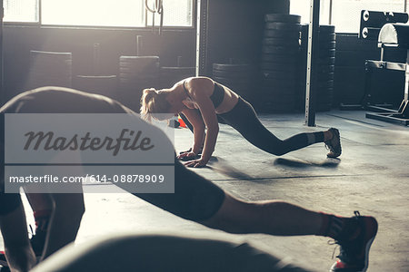 Crossfitters training in gym