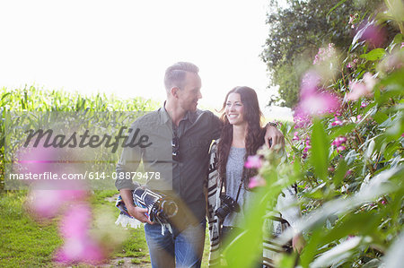 Romantic couple strolling in field