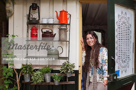 Portrait of young woman on cabin porch