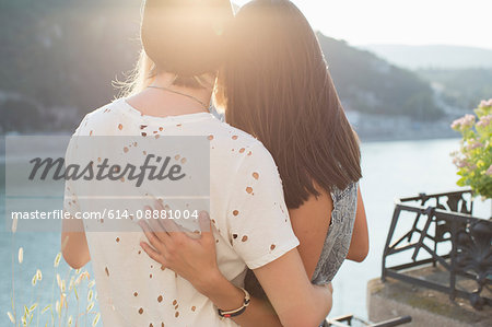 Romantic young couple looking out from roof terrace, Budapest, Hungary