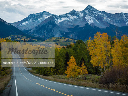 Country road with mountains on background