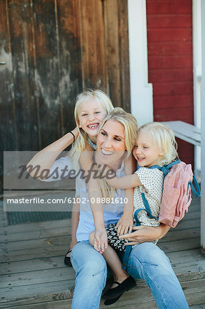 Happy mother with two daughter