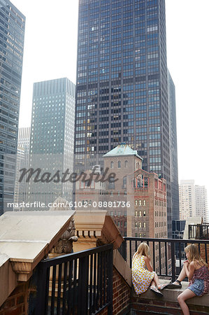 Girls looking at skyscrapers