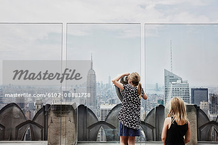 Girls looking at skyscrapers