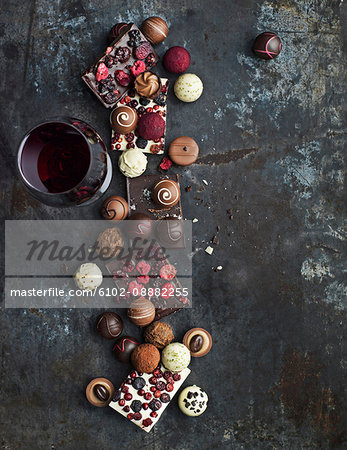 Red wine and various chocolate truffles and sweets Red wine and various chocolate truffles and sweets