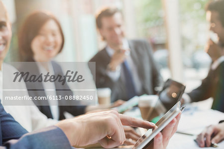 Businessman touching digital tablet in conference room meeting