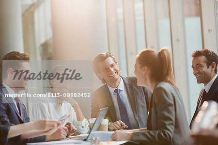 Smiling business people in conference room meeting