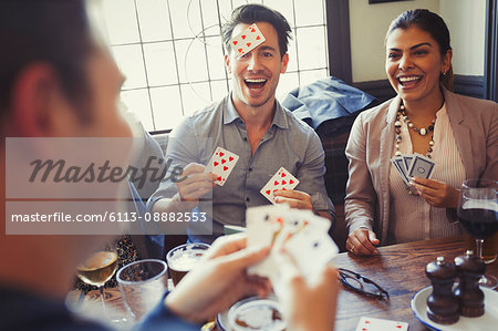 Friends playing Blind Man’s Bluff at bar