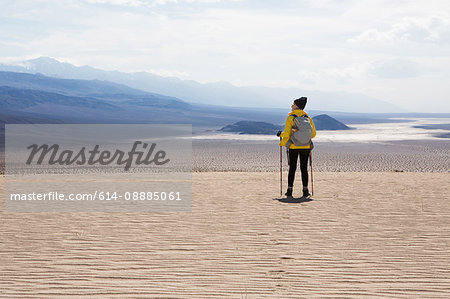 Trekker taking in sights, Death Valley National Park, California, US