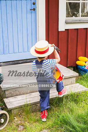 a boy playing outdoors