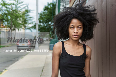 Portrait of young woman with afro hair