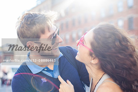 Couple laughing together outdoors