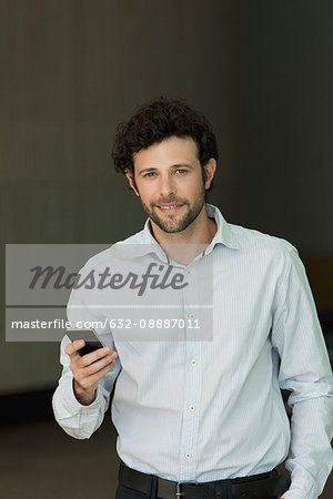 Businessman holding smartphone