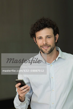 Businessman holding smartphone