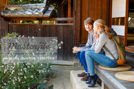 Caucasian couple at traditional Japanese house