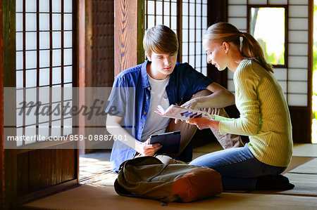 Caucasian couple at traditional Japanese house