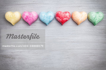 Love concept. Colorful hearts on grey rustic background