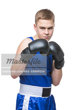 Young handsome boxer sportsman in blue boxer suit and black gloves standing on white backgound. Isolated. Copy space.