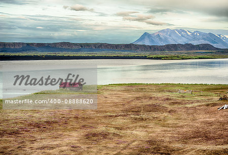 Old abandoned barn. Located in a wild Icelandic landscape in the valley under the mountains in the fjord