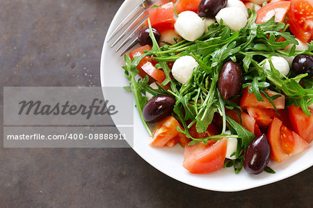 mozzarella salad with tomatoes and green arugula
